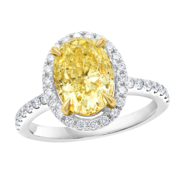 FANCY YELLOW OVAL DIAMOND SET IN 18K WHITE GOLD HALO SETTING